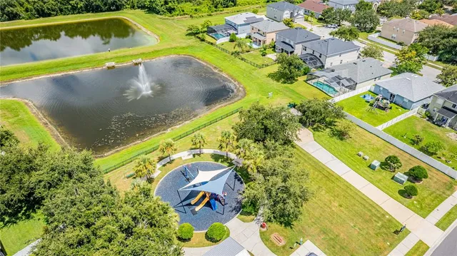 a view of a swimming pool with a yard
