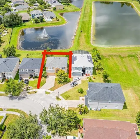 an aerial view of a house with a swimming pool