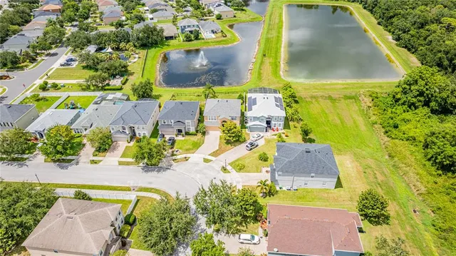 an aerial view of a house with a swimming pool