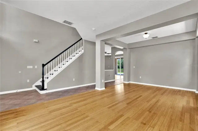 a view of an entryway with wooden floor
