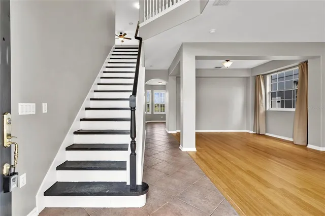 a view of entryway and hall with wooden floor