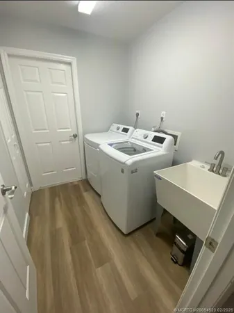 a utility room with dryer and washer