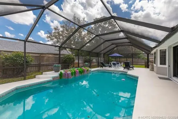 a view of yard with patio