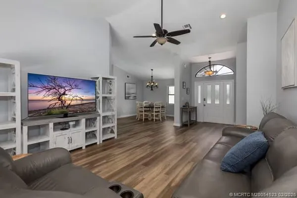 a living room with furniture and a flat screen tv
