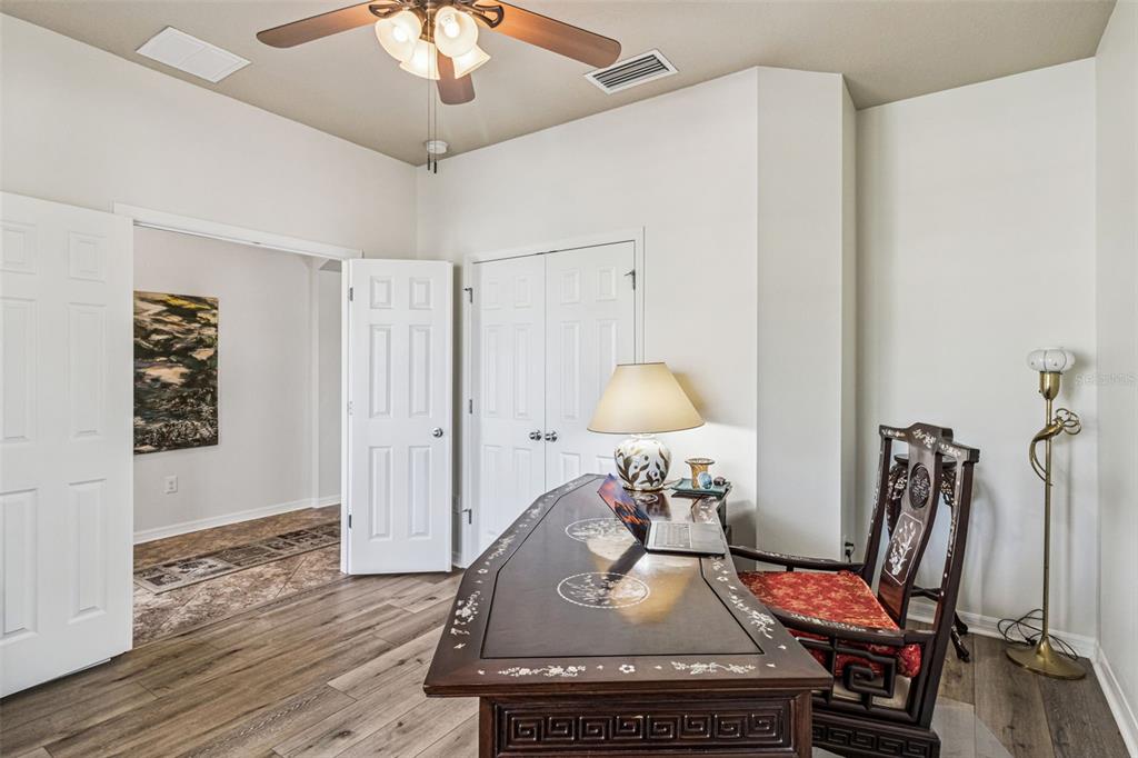 31518 Bearded Oak Drive Wesley Chapel, FL 33543 - Photo 35 of 56 a room with furniture and wooden floor