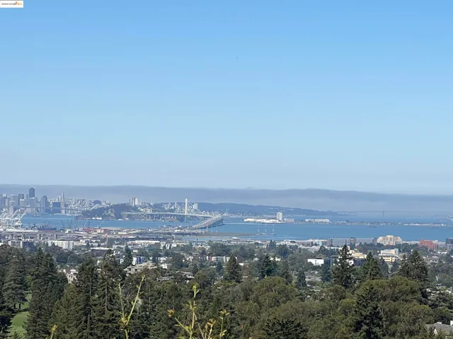 an aerial view of city and mountain