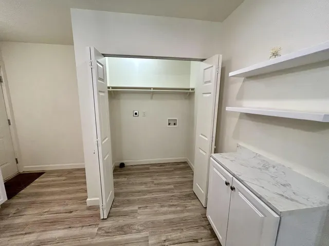 a bathroom with a sink and a glass door shower