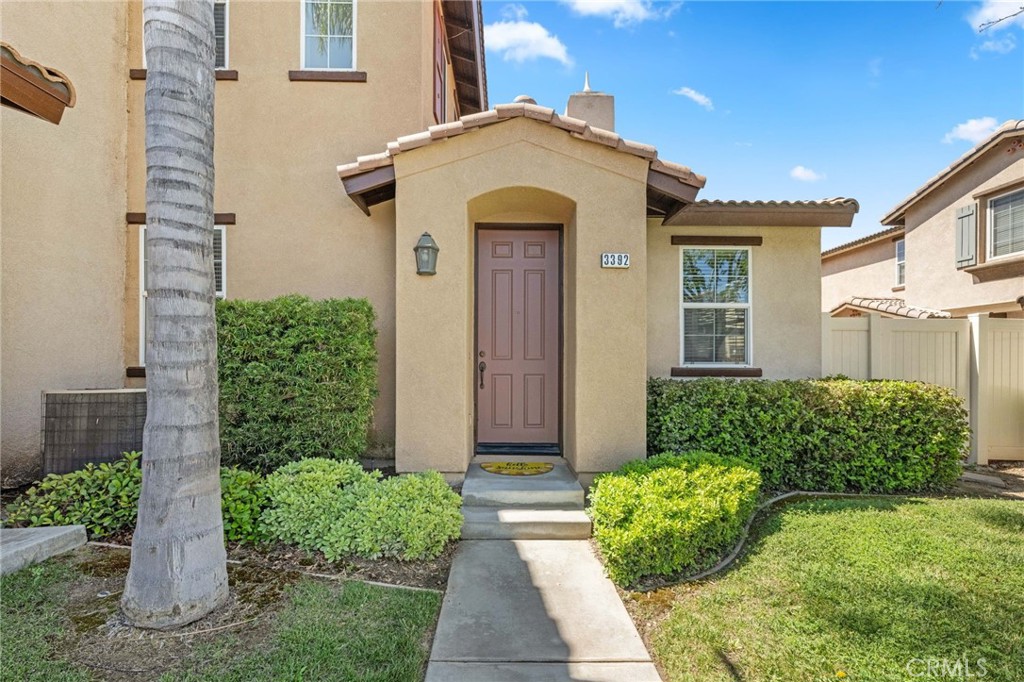 3392 Wind Chime Lane Perris, CA 92571 - Photo 1 of 1 a view of a house with a small yard plants and large tree
