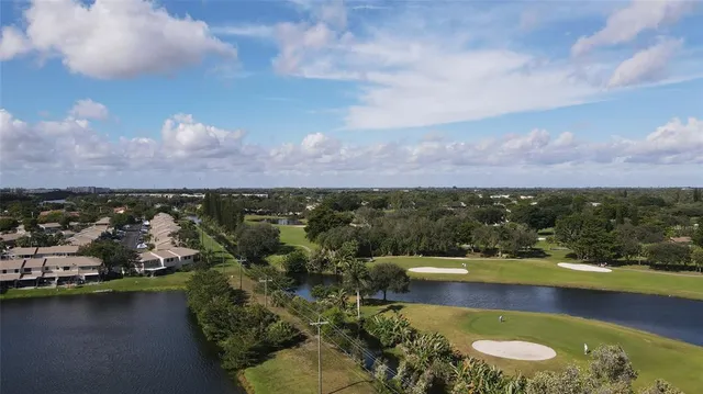 aerial view of a house with a lake view