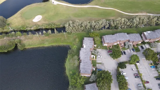 an aerial view of a house with a lake view