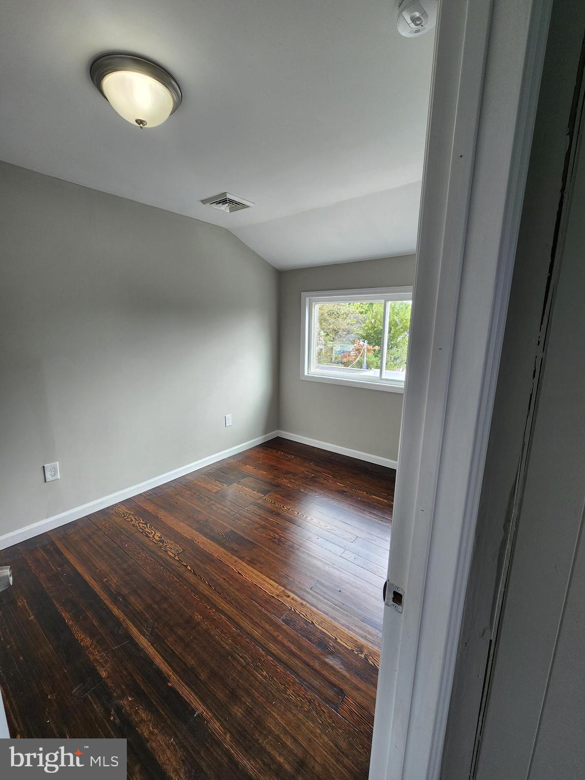 10 Webster Avenue Stratford, NJ 08084 - Photo 11 of 20 a view of room with window and wooden floor