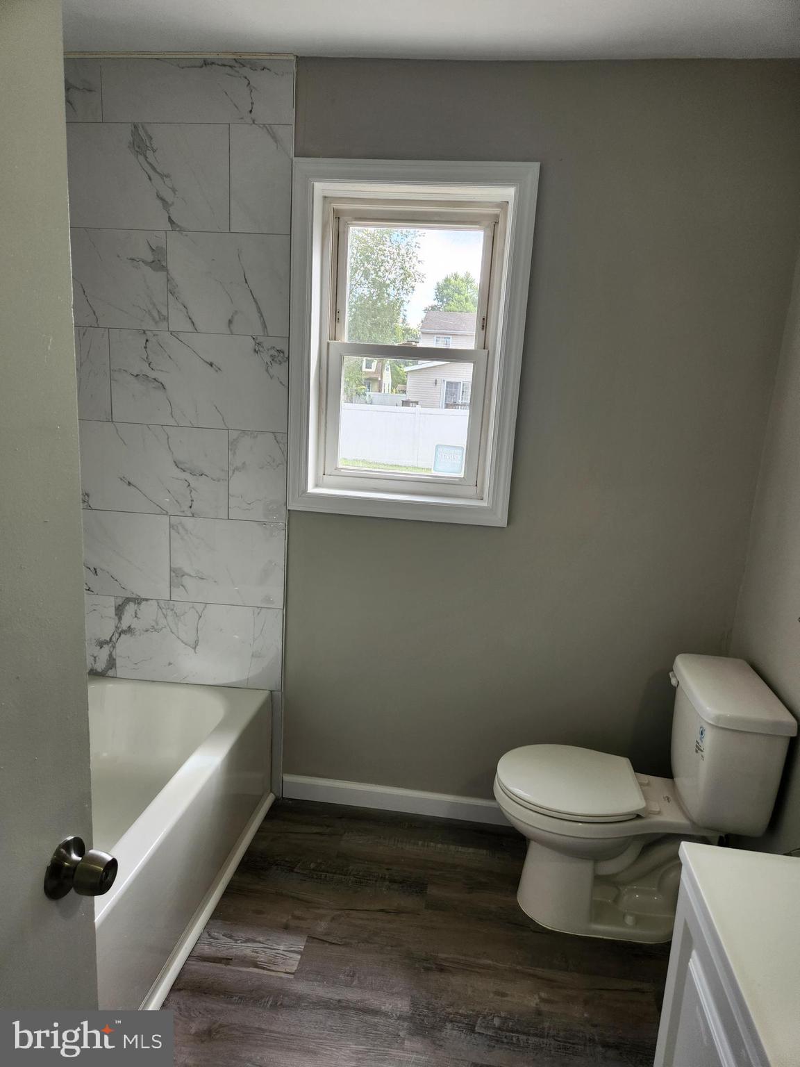 10 Webster Avenue Stratford, NJ 08084 - Photo 17 of 20 a bathroom with a toilet and a bathtub