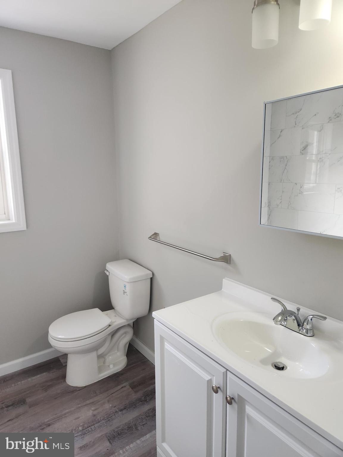 10 Webster Avenue Stratford, NJ 08084 - Photo 18 of 20 a bathroom with a sink and a toilet
