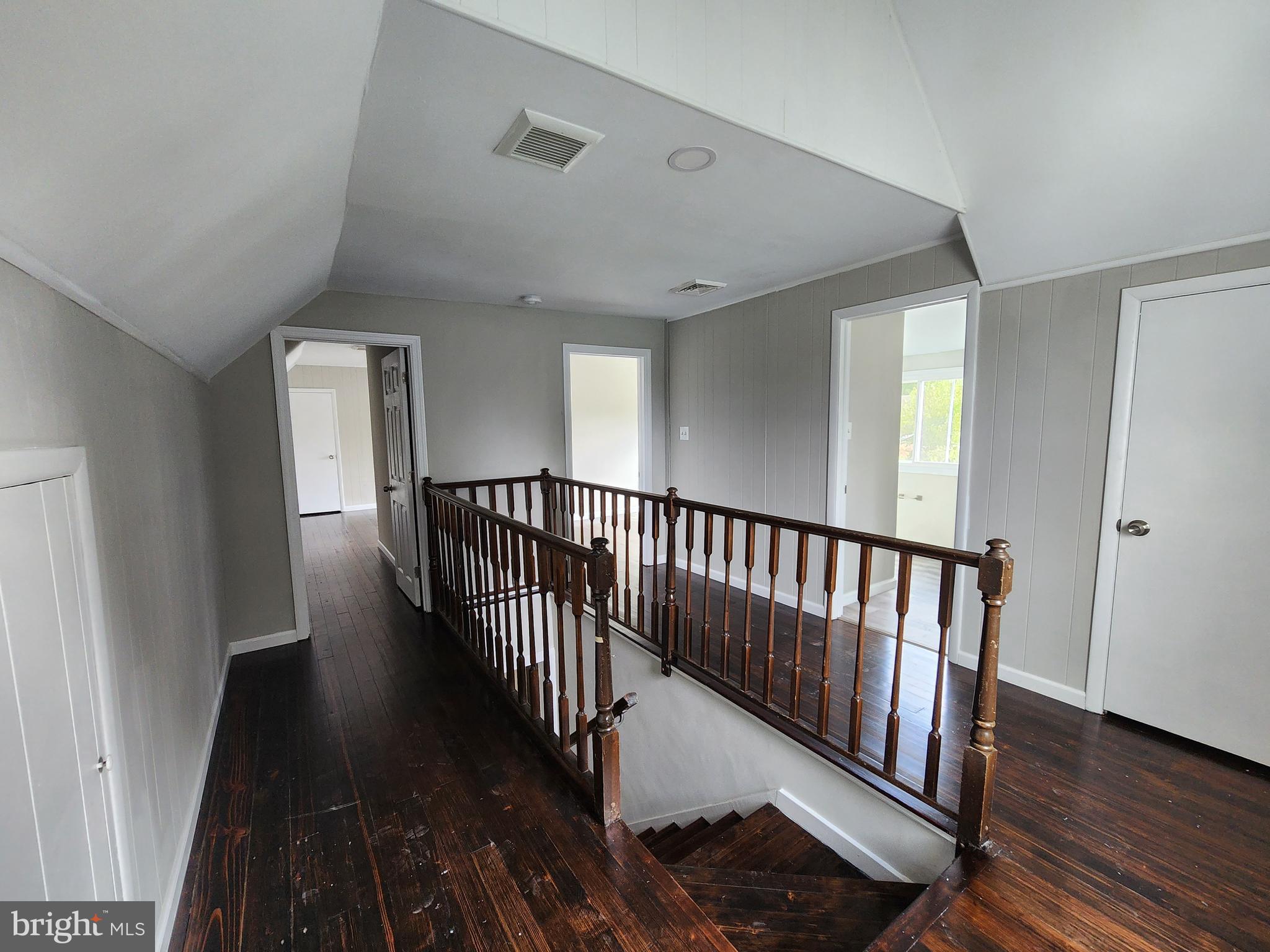 10 Webster Avenue Stratford, NJ 08084 - Photo 6 of 20 a view of a hallway with wooden floor and stairs