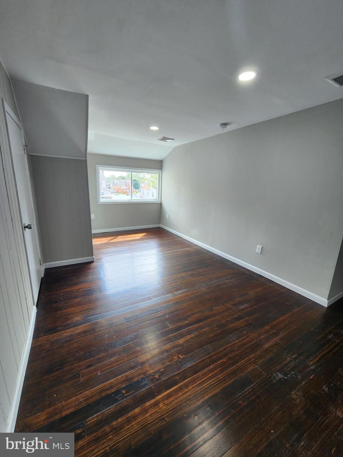 10 Webster Avenue Stratford, NJ 08084 - Photo 9 of 20 an empty room with wooden floor and windows