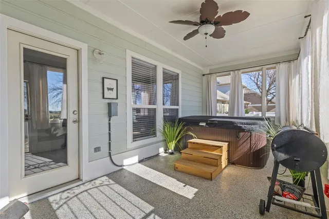 a living room with a couch and a chandelier