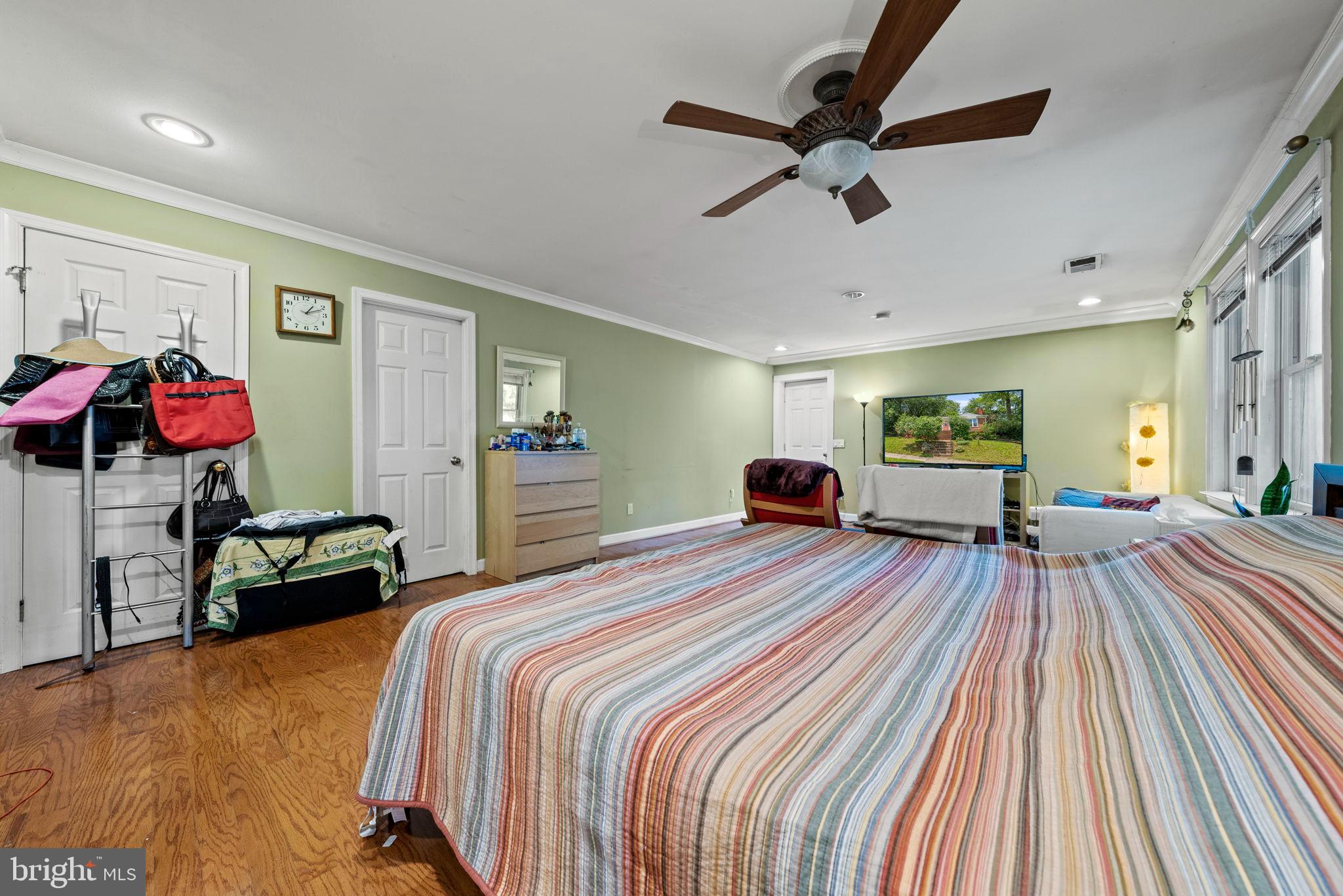 6517 29th Street North Arlington, VA 22213 - Photo 20 of 49 a bedroom with a bed and a chandelier