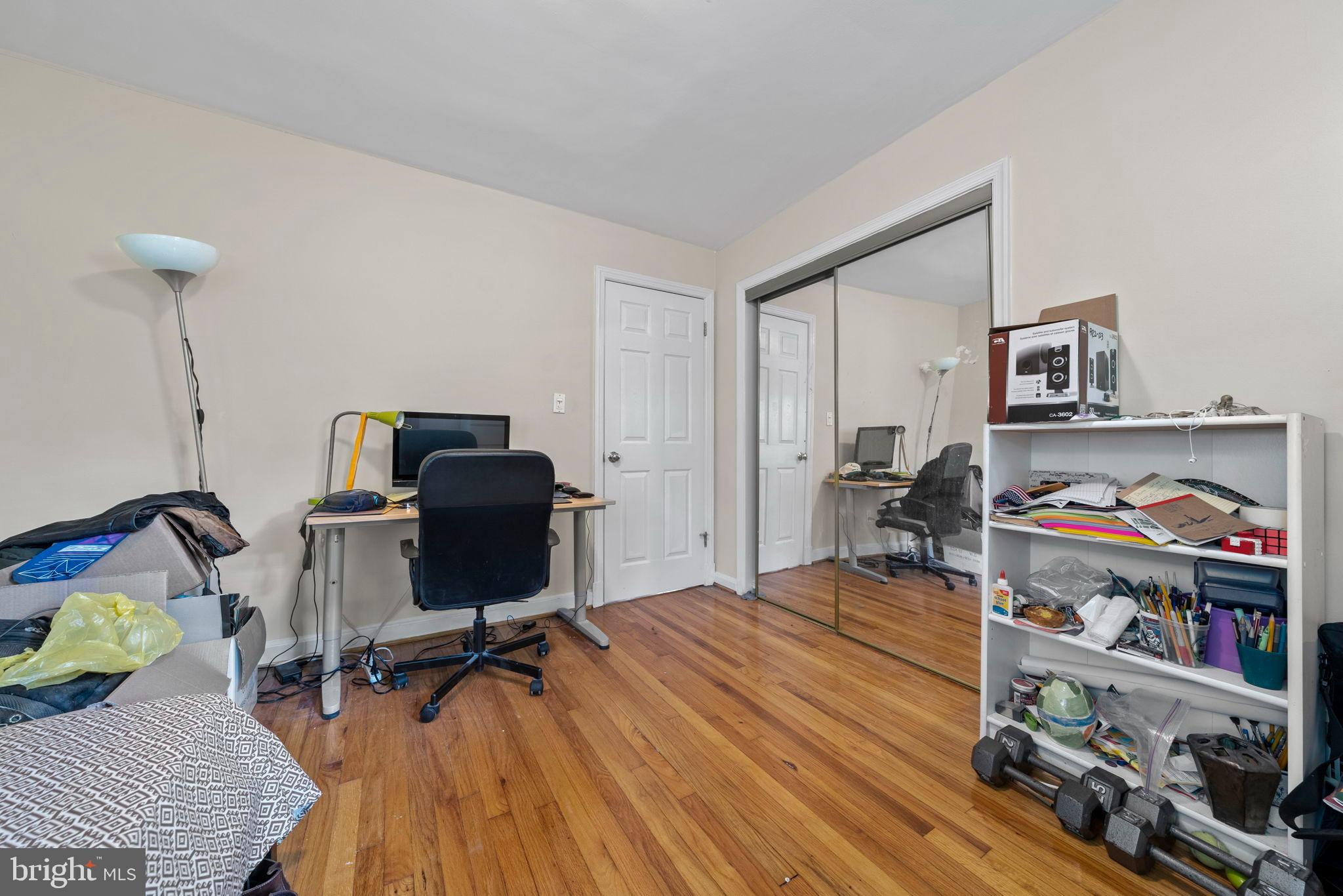 6517 29th Street North Arlington, VA 22213 - Photo 24 of 49 a workspace with furniture and hardwood floor