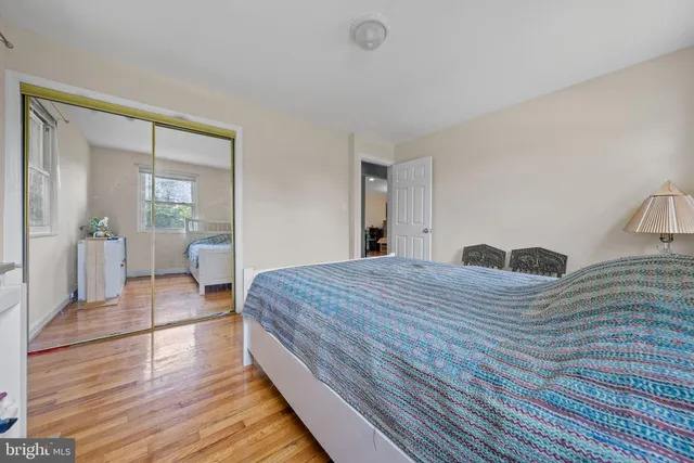 a bedroom with a bed and a table