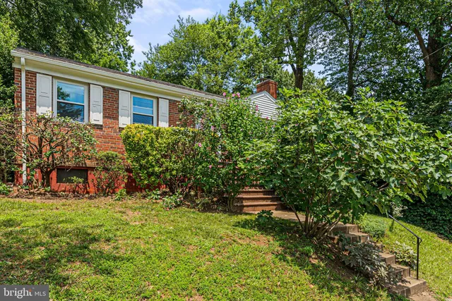 a view of house with yard