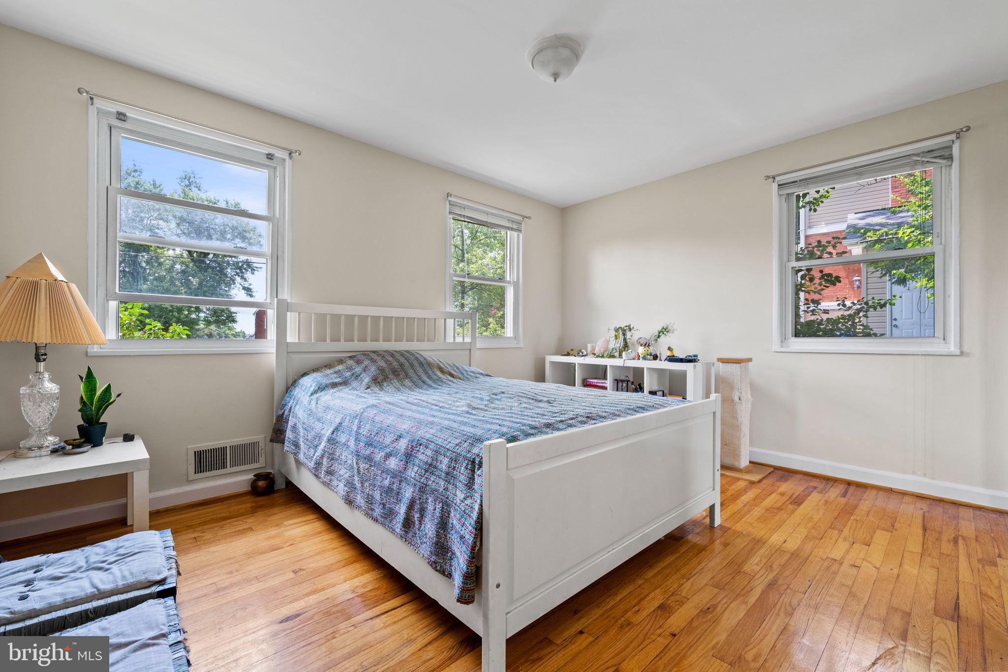 6517 29th Street North Arlington, VA 22213 - Photo 31 of 49 a spacious bedroom with a bed and a window