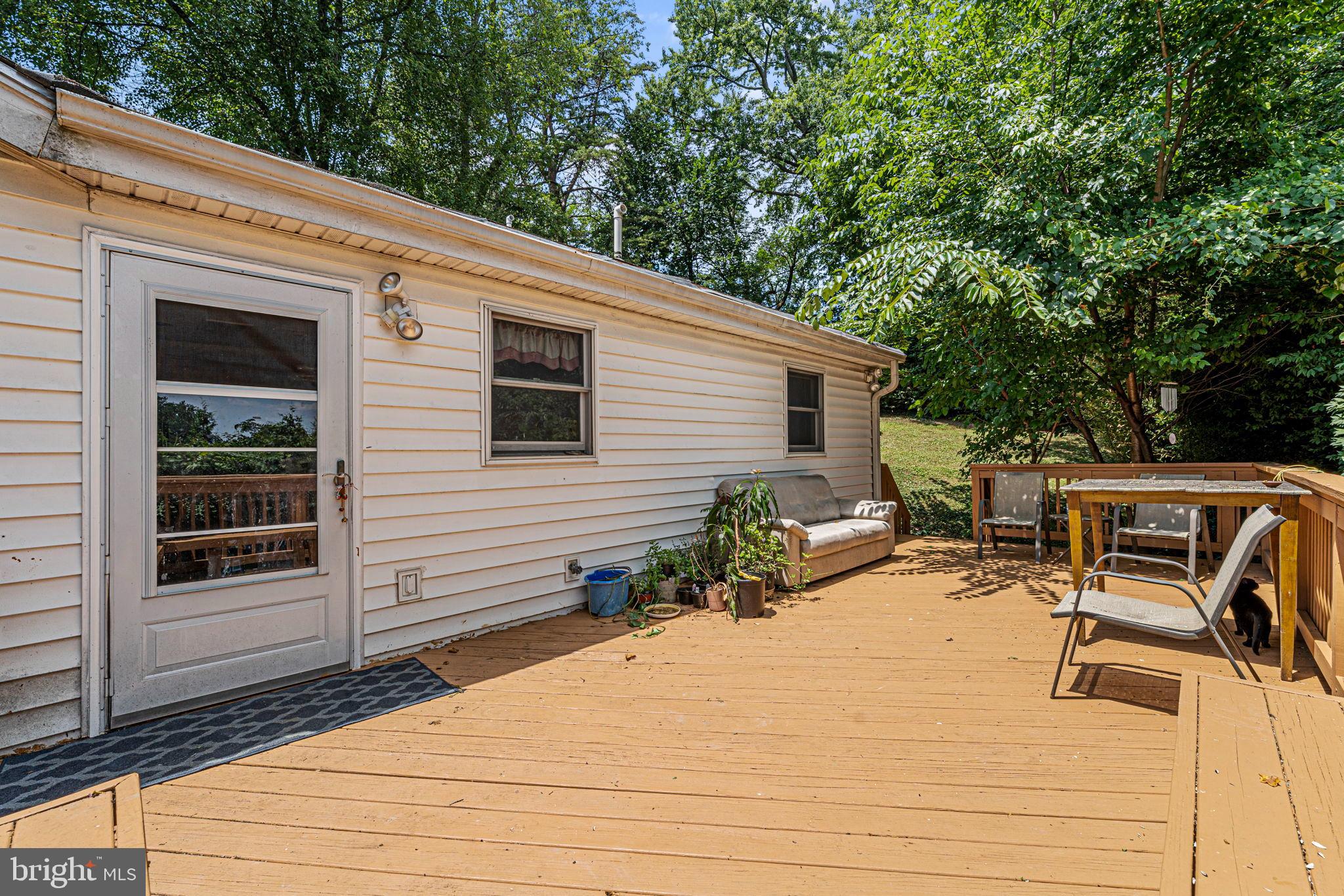 6517 29th Street North Arlington, VA 22213 - Photo 32 of 49 a view of a patio with table and chairs with wooden fence and plants