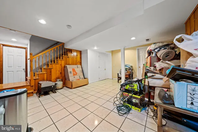 a bedroom with furniture and a rug