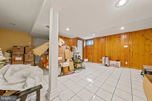 a bedroom with furniture and wooden floor