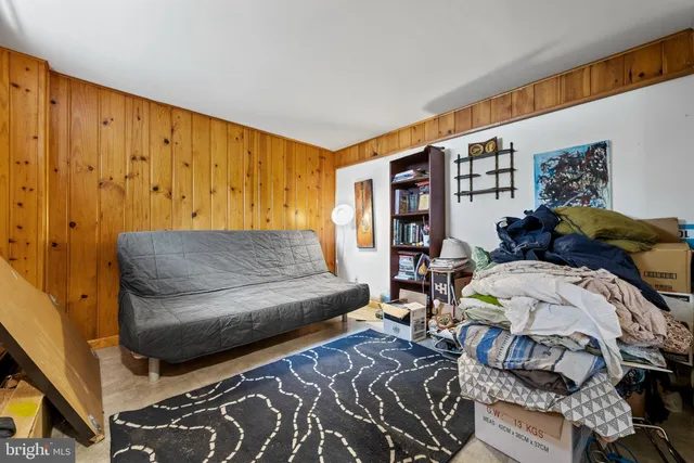 a bed room with a bed and a large window