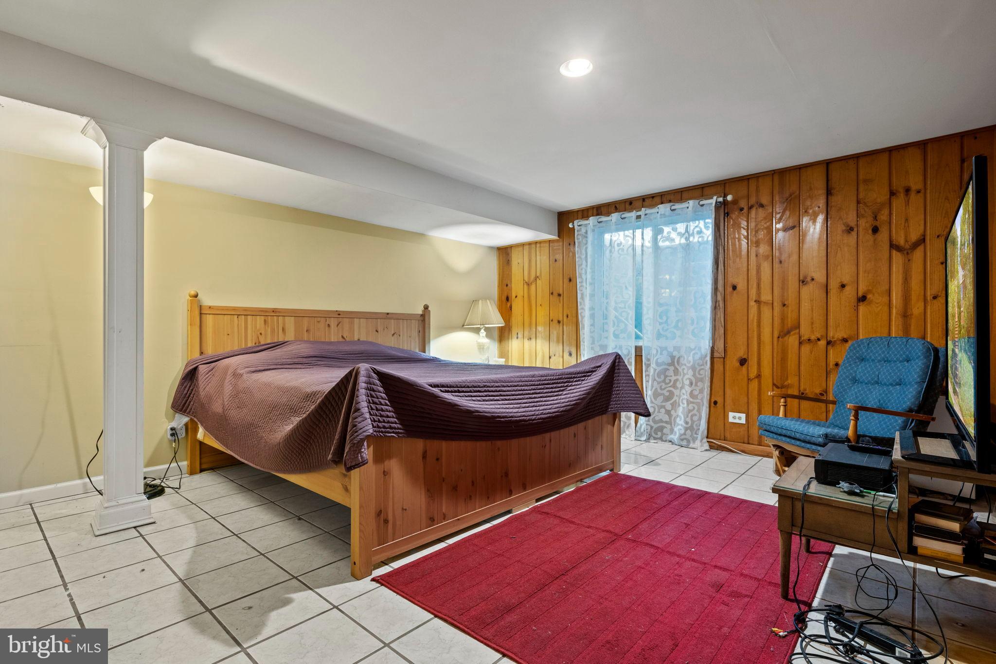 6517 29th Street North Arlington, VA 22213 - Photo 41 of 49 a bedroom with a bed and wooden floor