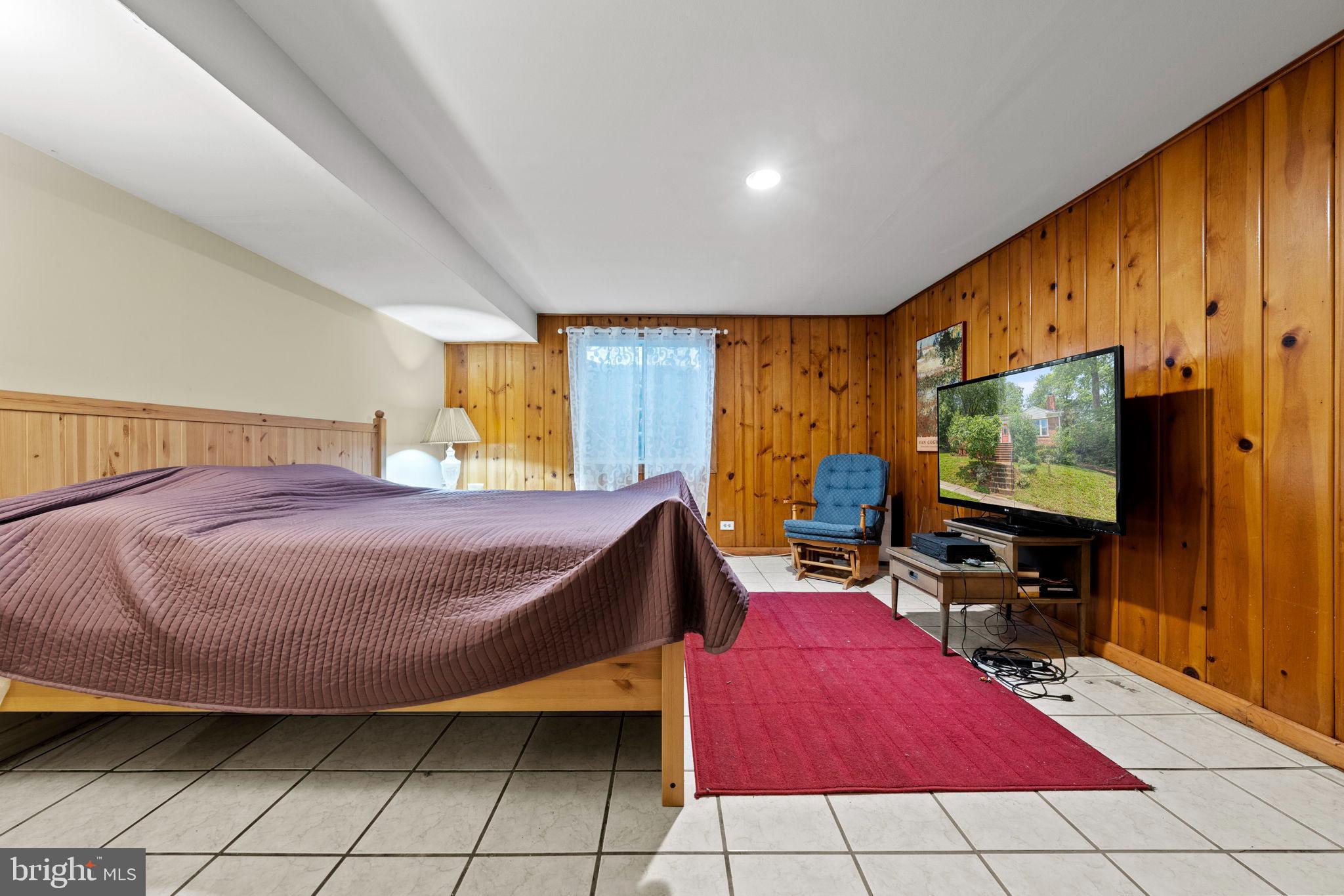 6517 29th Street North Arlington, VA 22213 - Photo 42 of 49 a bedroom with a bed and flat screen tv