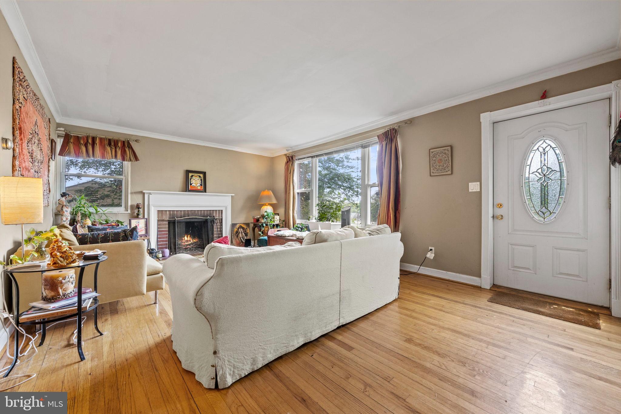 6517 29th Street North Arlington, VA 22213 - Photo 7 of 49 a living room with furniture a fireplace and a large window
