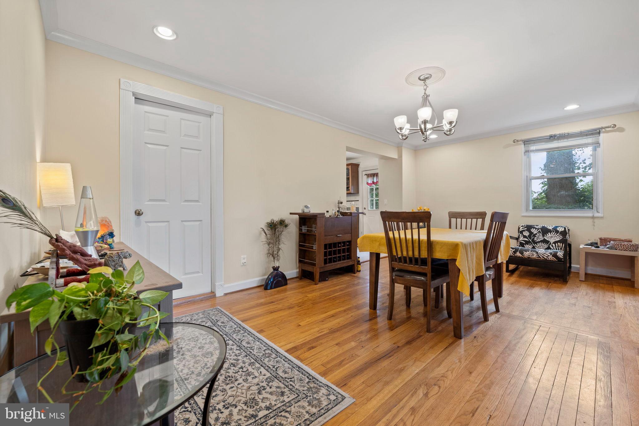 6517 29th Street North Arlington, VA 22213 - Photo 8 of 49 a view of a dining room with furniture and wooden floor