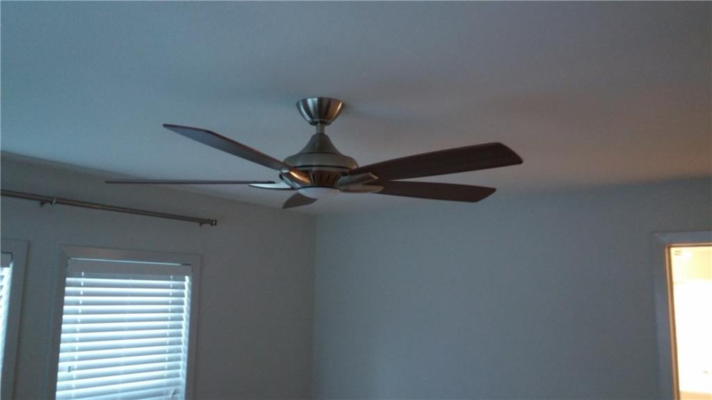 1139 Poquito Street Austin, TX 78702 - Photo 11 of 14 a lamp on a walk in closet