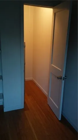 an empty room with wooden floor