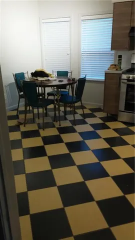 a view of a workspace with wooden floor