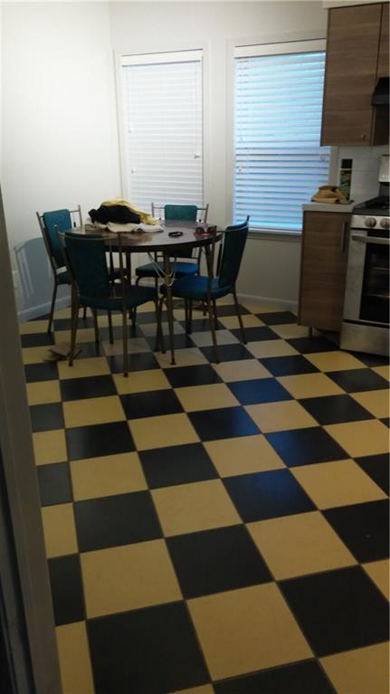 1139 Poquito Street Austin, TX 78702 - Photo 3 of 14 a view of a workspace with wooden floor