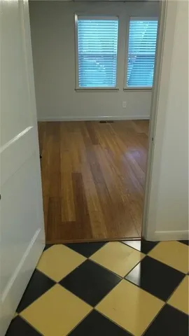 a view of an empty room with a sink