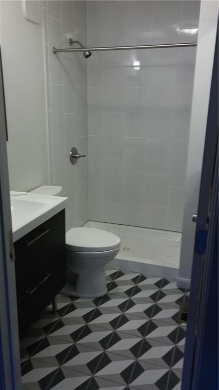 1139 Poquito Street Austin, TX 78702 - Photo 7 of 14 a bathroom with a toilet and a shower