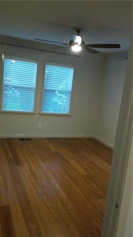 1139 Poquito Street Austin, TX 78702 - Photo 9 of 14 a view of a small space with wooden floor and a window
