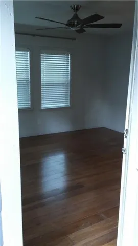 a view of wooden floor in an empty room