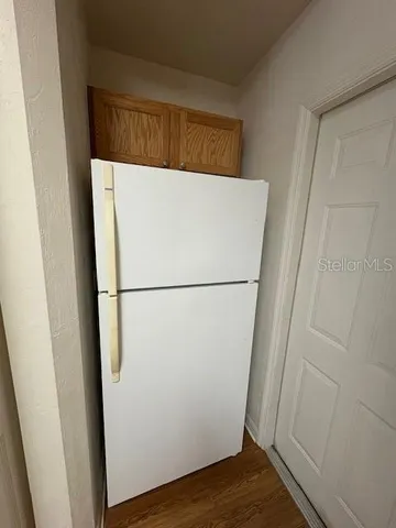a view of a dinning table and chairs in patio
