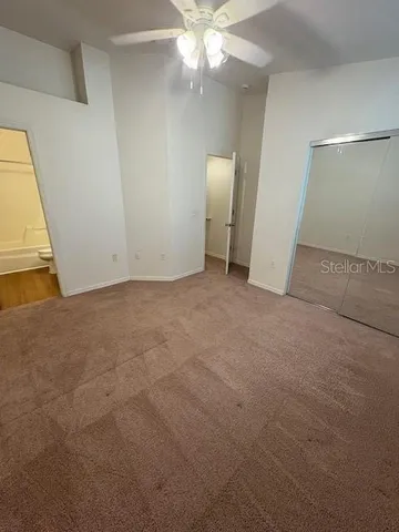 a front view of a building with a garden