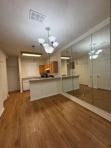 a white refrigerator freezer and a stove sitting inside of a kitchen