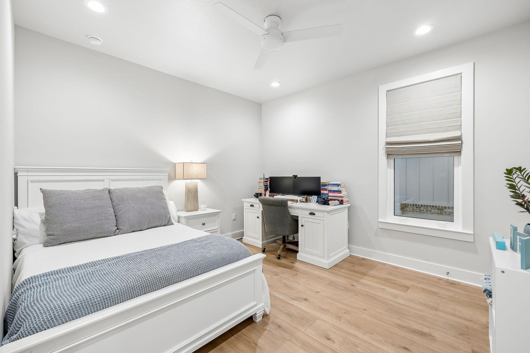 39 West Captain Fritz Way Freeport, FL 32439 - Photo 22 of 33 a room with a bed and a table