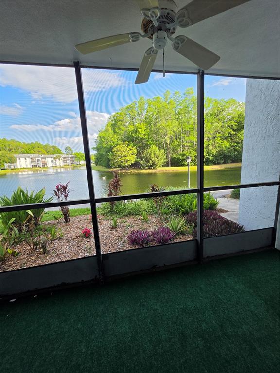1281 Pine Ridge Circle East, Unit B1 Tarpon Springs, FL 34688 - Photo 24 of 30 a view of a garden from a window