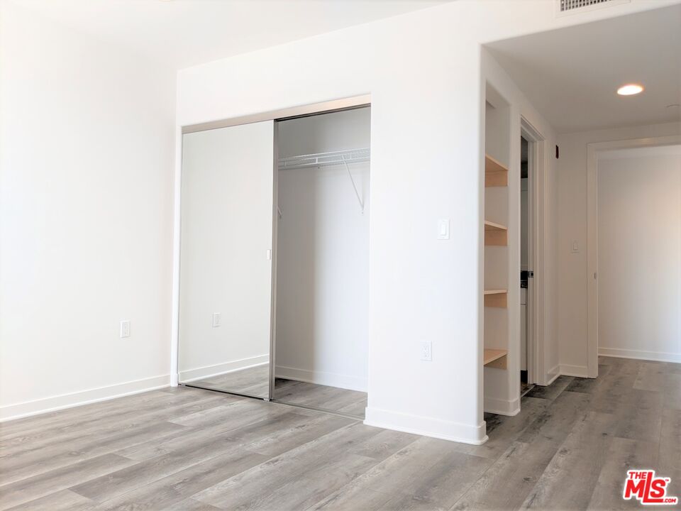 5143 White Oak Avenue, Unit 306 Encino, CA 91316 - Photo 25 of 32 a view of an empty room with wooden floor
