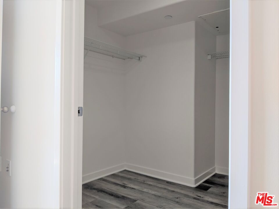 5143 White Oak Avenue, Unit 306 Encino, CA 91316 - Photo 30 of 32 a small space with wooden floor and a window