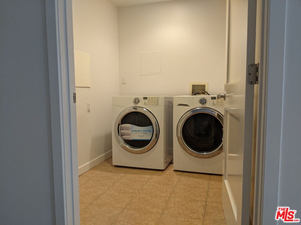 5143 White Oak Avenue, Unit 306 Encino, CA 91316 - Photo 8 of 32 a utility room with dryer and washer