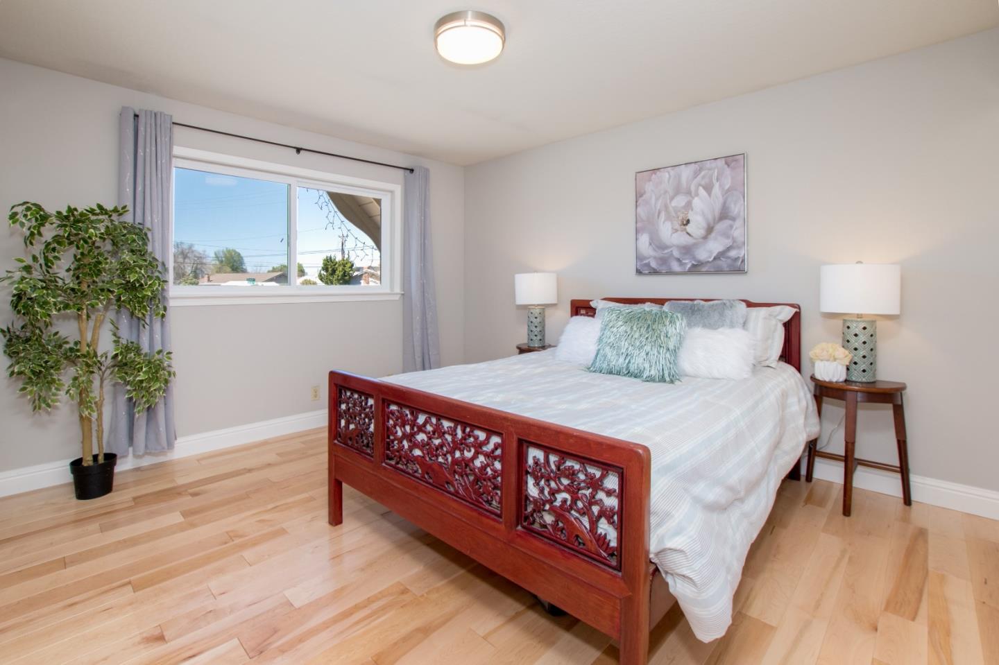 3416 Tracy Drive Santa Clara, CA 95051 - Photo 13 of 26 a bed sitting in a bedroom next to a window